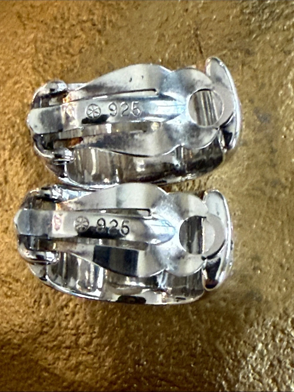 CHANEL Sterling Silver Logo Clip Hoop Earrings